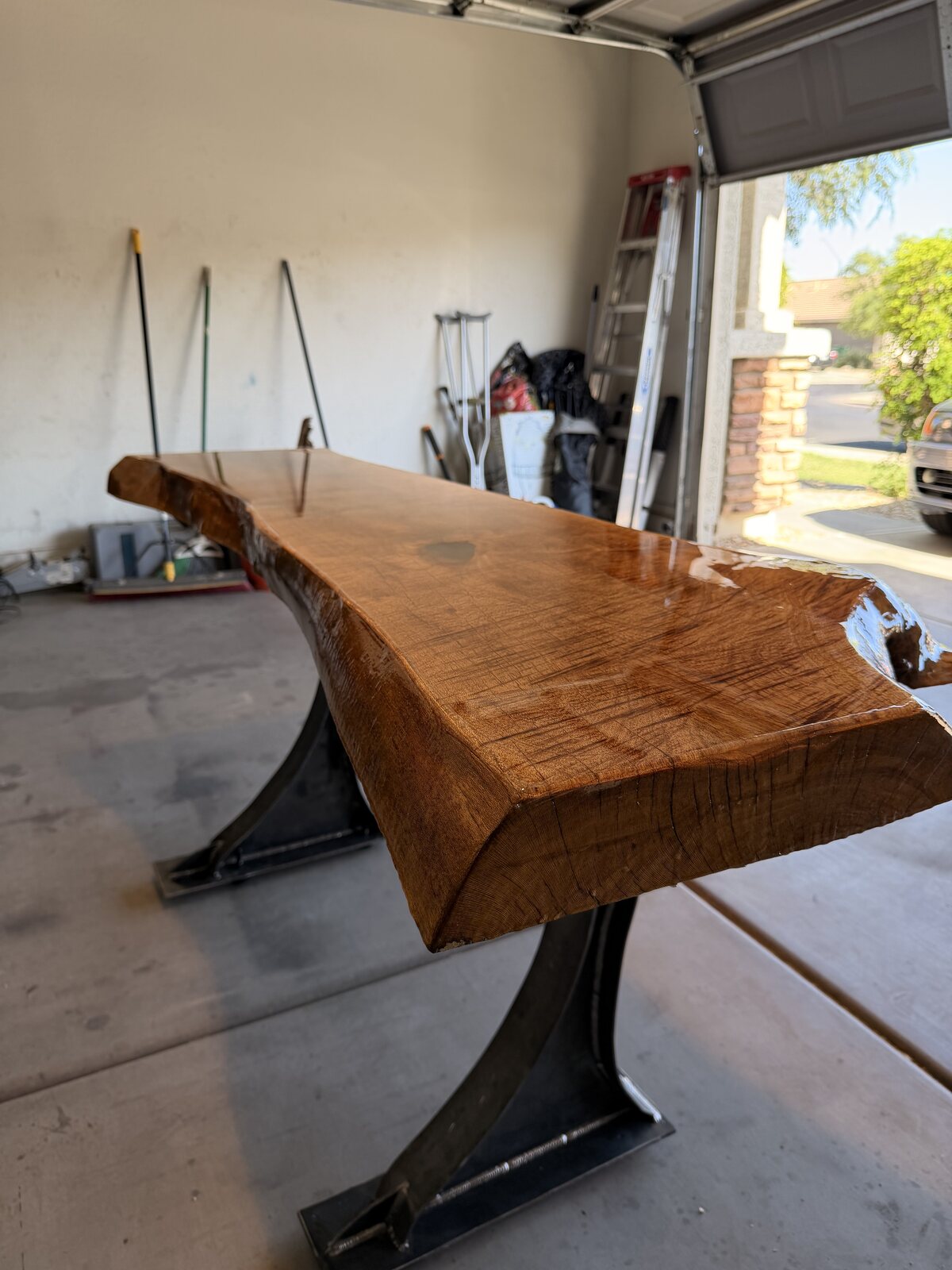 Sealed live-edge wood desk top with natural edge detail
